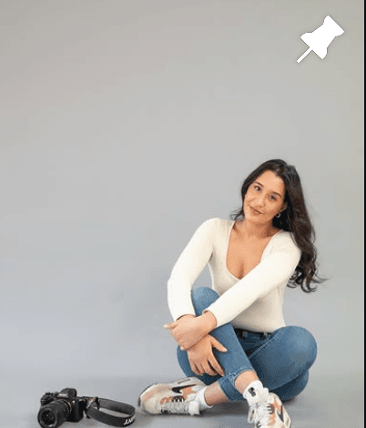 Najaeh with camera in a studio portrait